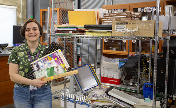 woman in front of a cart with office supplies